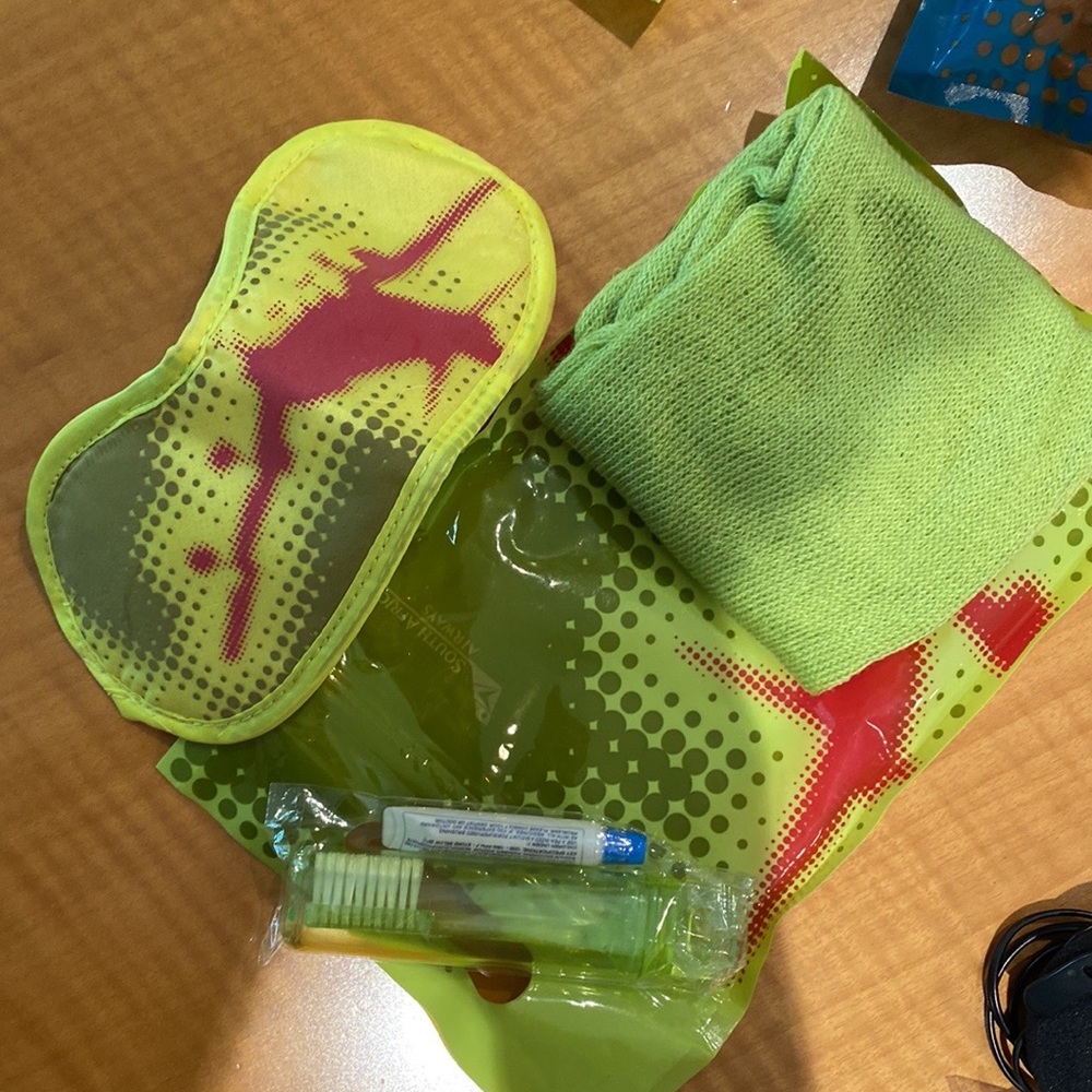 Traveling essentials kits: Sleep masks, socks, toothbrush, head phones, airplane